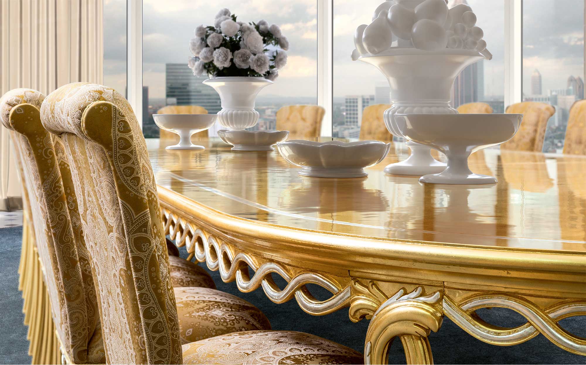 Classic dining table with golden finishes and velvet-upholstered chairs