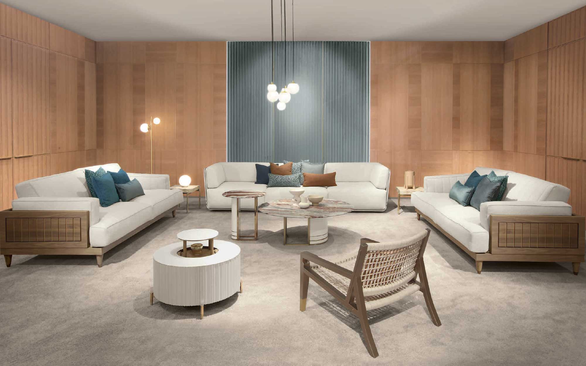 Bright living room with light wood and fabric sofas, modern round coffee tables and natural wood panel walls