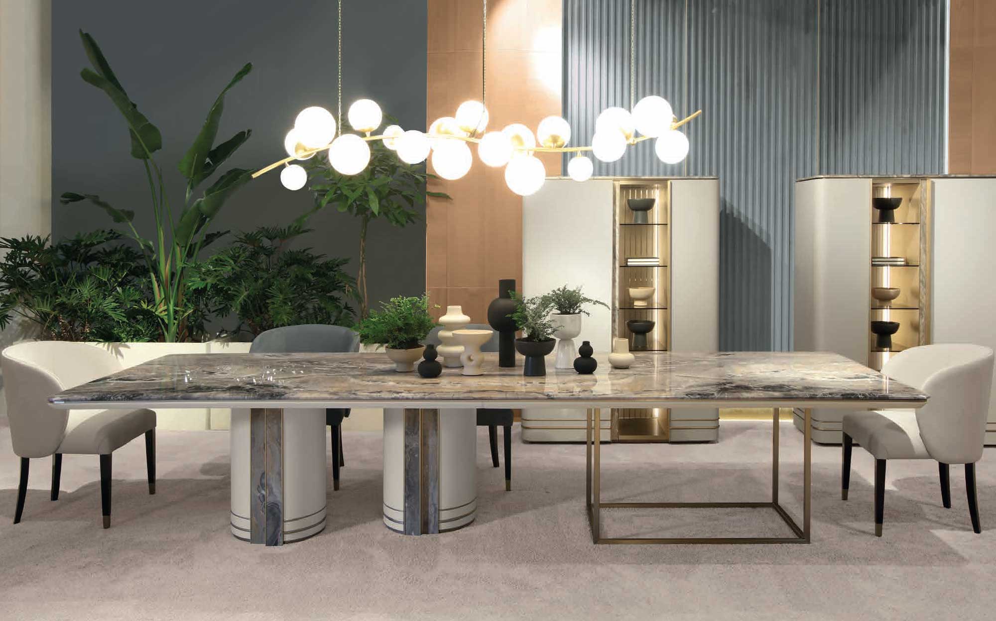Modern dining room with marble table, upholstered chairs and illuminated sideboards