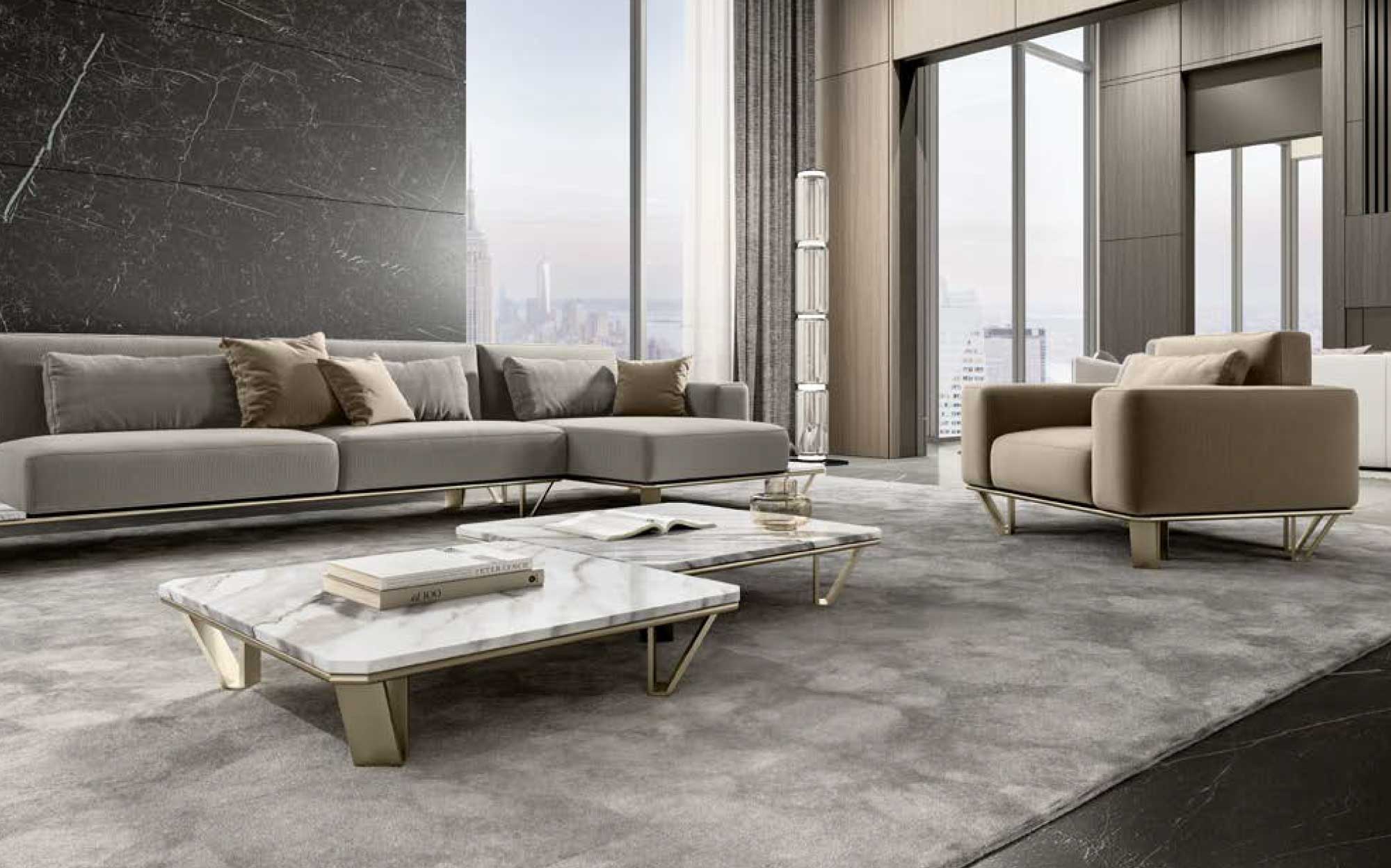 Contemporary furniture for elegant and minimal living rooms | 101DOMUS Modern living room with modular grey sofa, beige armchair and low marble tables with gold accents