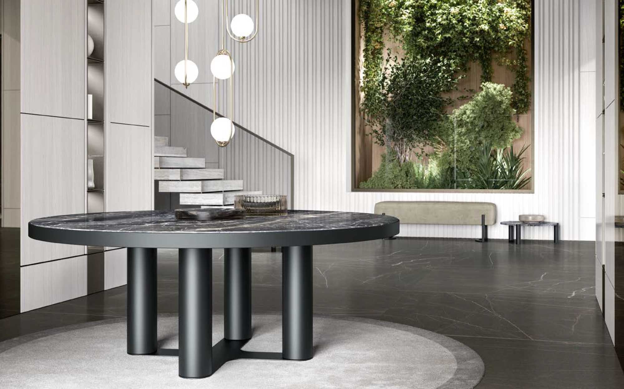 Designer entrance furniture with architectural and natural elements | 101DOMUS Modern entrance with round dark marble table, globe pendant light and decorative vertical green wall