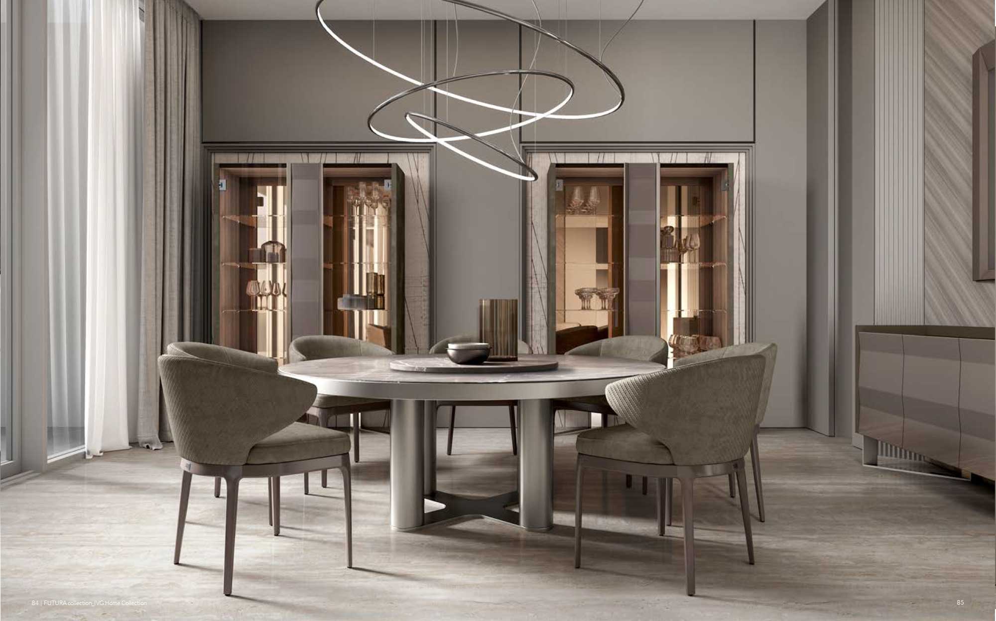 Refined furniture for contemporary dining spaces | 101DOMUS Modern dining room with round table, taupe upholstered chairs and sculptural pendant lighting