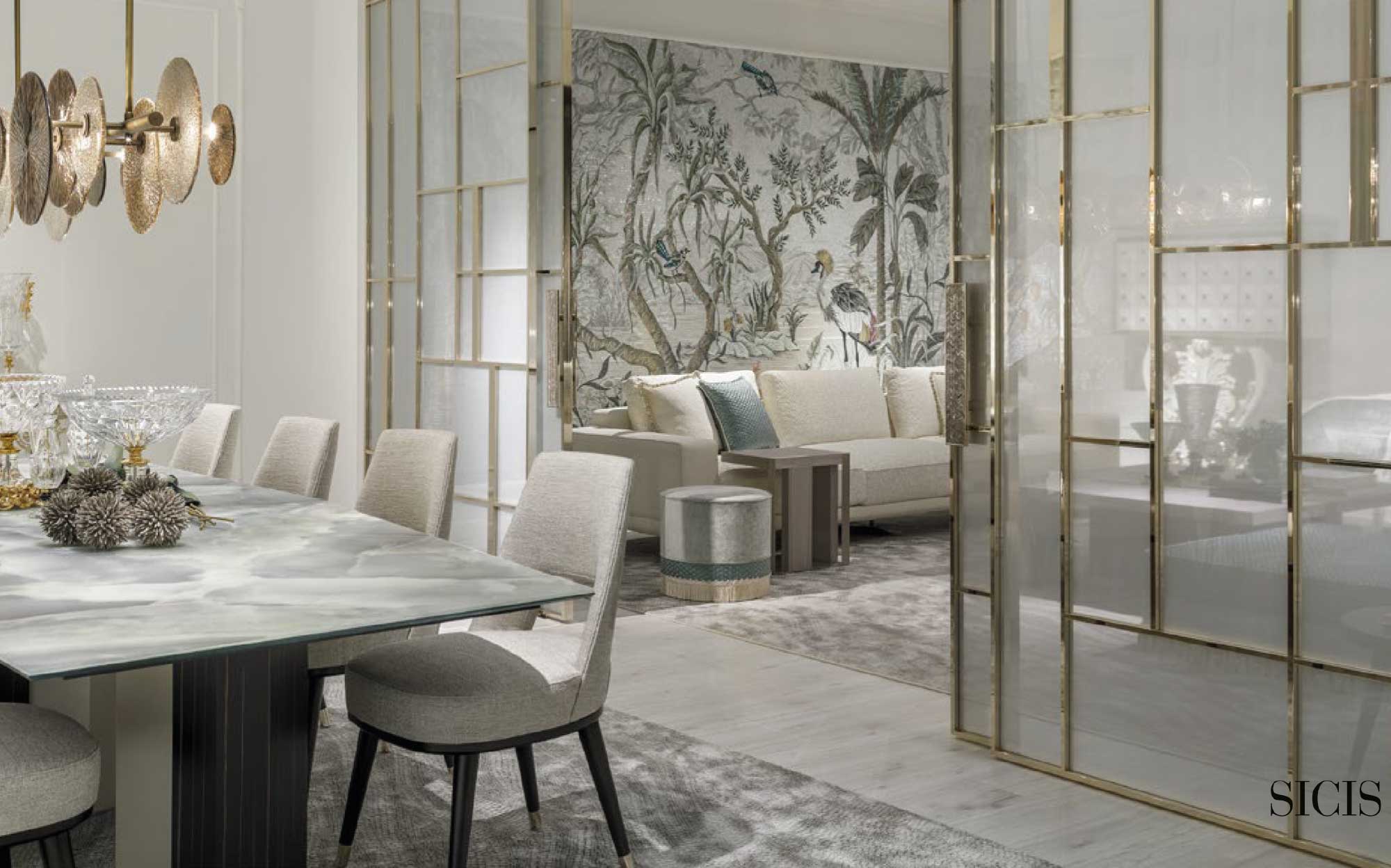 Bright elegance and artistic detail in Sicis living and dining room | 101DOMUS Sicis dining area with onyx table, light upholstered chairs and a living room featuring corner sofa and artistic mosaic wall